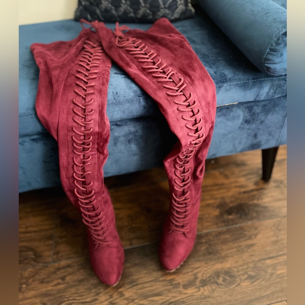 Burgundy tie up High thigh platform boot heels.